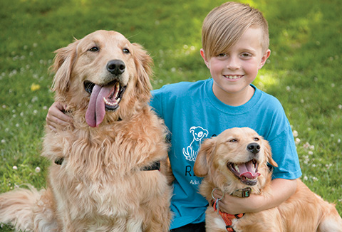 His surname may be Katz, but Ethan’s heart has gone to the dogs—in this case his family’s rescue pooches Fly (left) and Brooklyn. Fred Schilling/Fredschilling.com