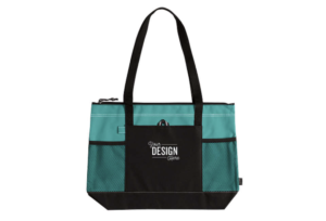 A Turquoise Large Multi-Pocket Zippered Tote Bag. The main compartment is turquoise while the outer pockets and straps are black. "Your Design Here" is displayed in white on the outer black pocket.