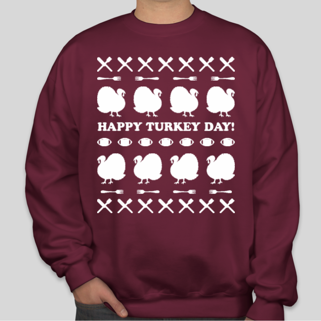 A custom tacky holiday t-shirt that features crossed table utensils, turkeys, footballs, and the text Happy Turkey Day!