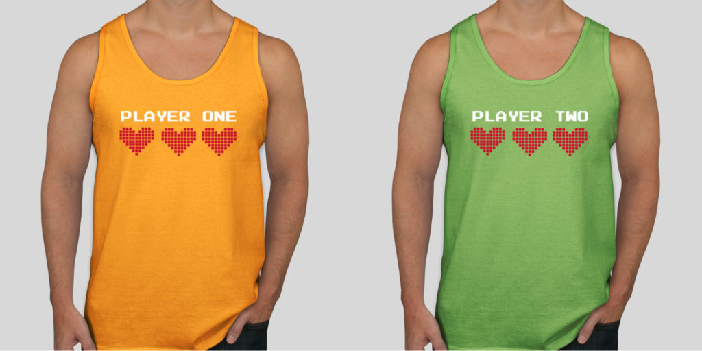 A pair of custom couple shirts with Player one and Player two written on them.