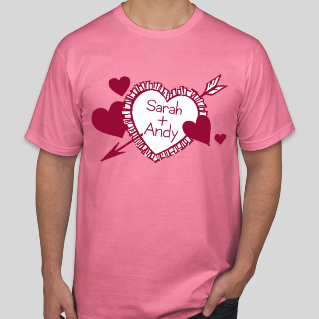 A custom t-shirt with an arrowed heart and the names sarah and andy drawn on it.