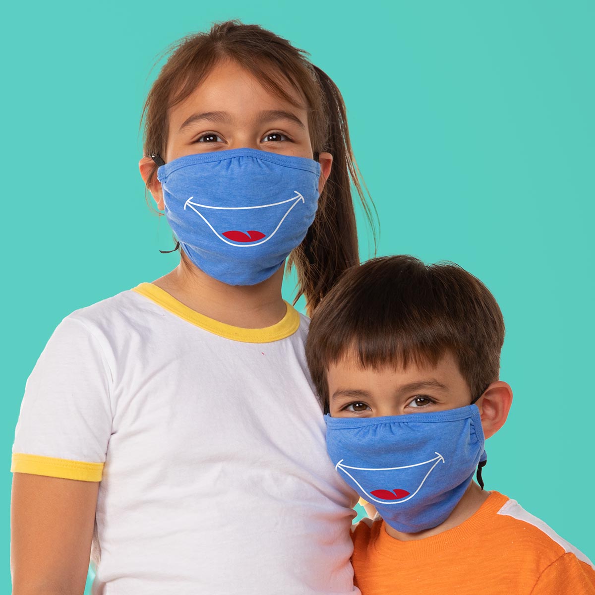 two kids in masks with a smile print on them