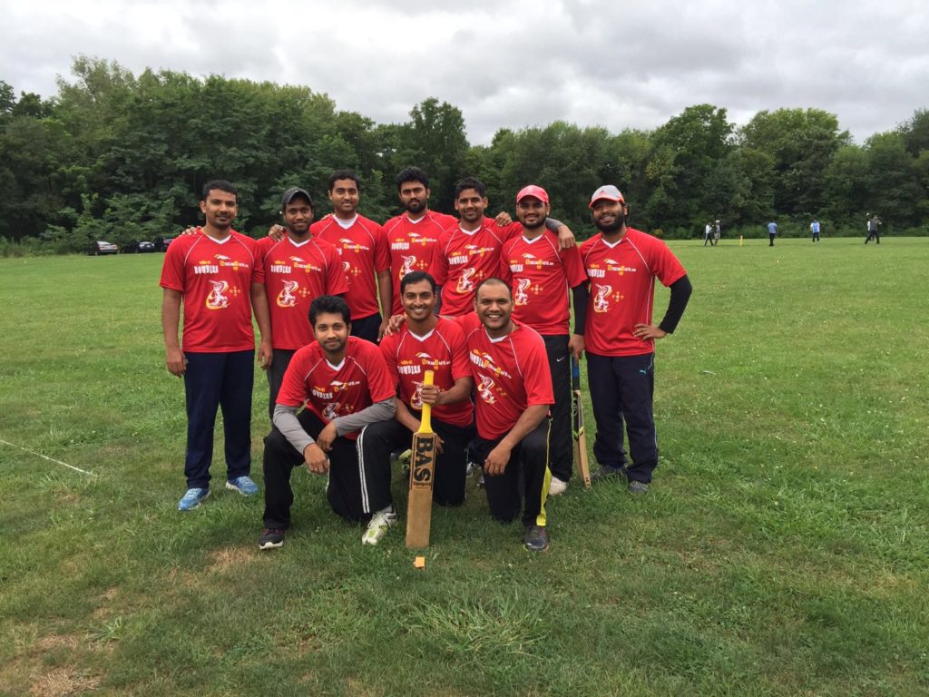 Cricket team posing together in their matching custom t-shirts