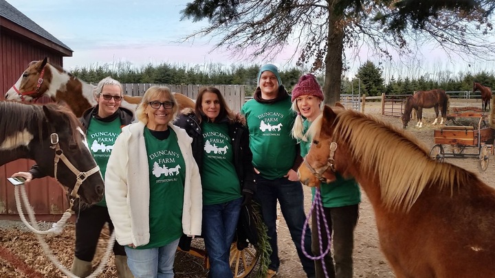 A group of farm girls with their matching custom t-shirts and horses