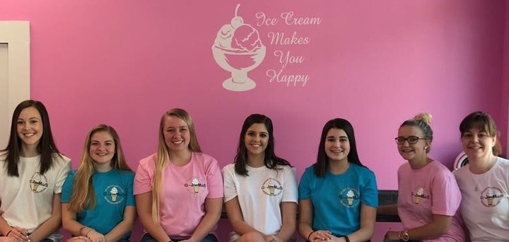 An ice cream shop wearing matching custom t-shirts.