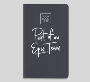Welcome gifts for new employees, like this notebook with a company logo and reads, "Part of an Epic Team," can help increase feelings of belonging.