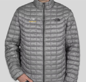 A premium present sure to impress, The North Face ThermoBall Trekker Jacket in grey has an embroidered example of "Your Game Co." on the right chest and the embroidered logo for The North Face on the left.