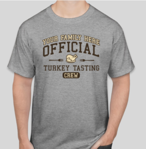 A gray t-shirt that says "Your family here" as an example of where to put your group name, and "official turkey tasting crew" beneath it. 