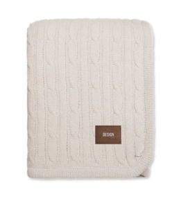 Photo of a Debossed Kanata Cable Knit Lambswool Blanket in the color cream