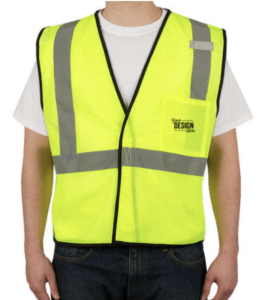 A person wearing a Lime-colored Kishigo Class 2 Mesh Safety Vest over a white shirt. Reflective tape goes down the left and right sides of the vest and horizontally across the front. "Your Design Here" is printed on the left chest pocket in black ink. 
