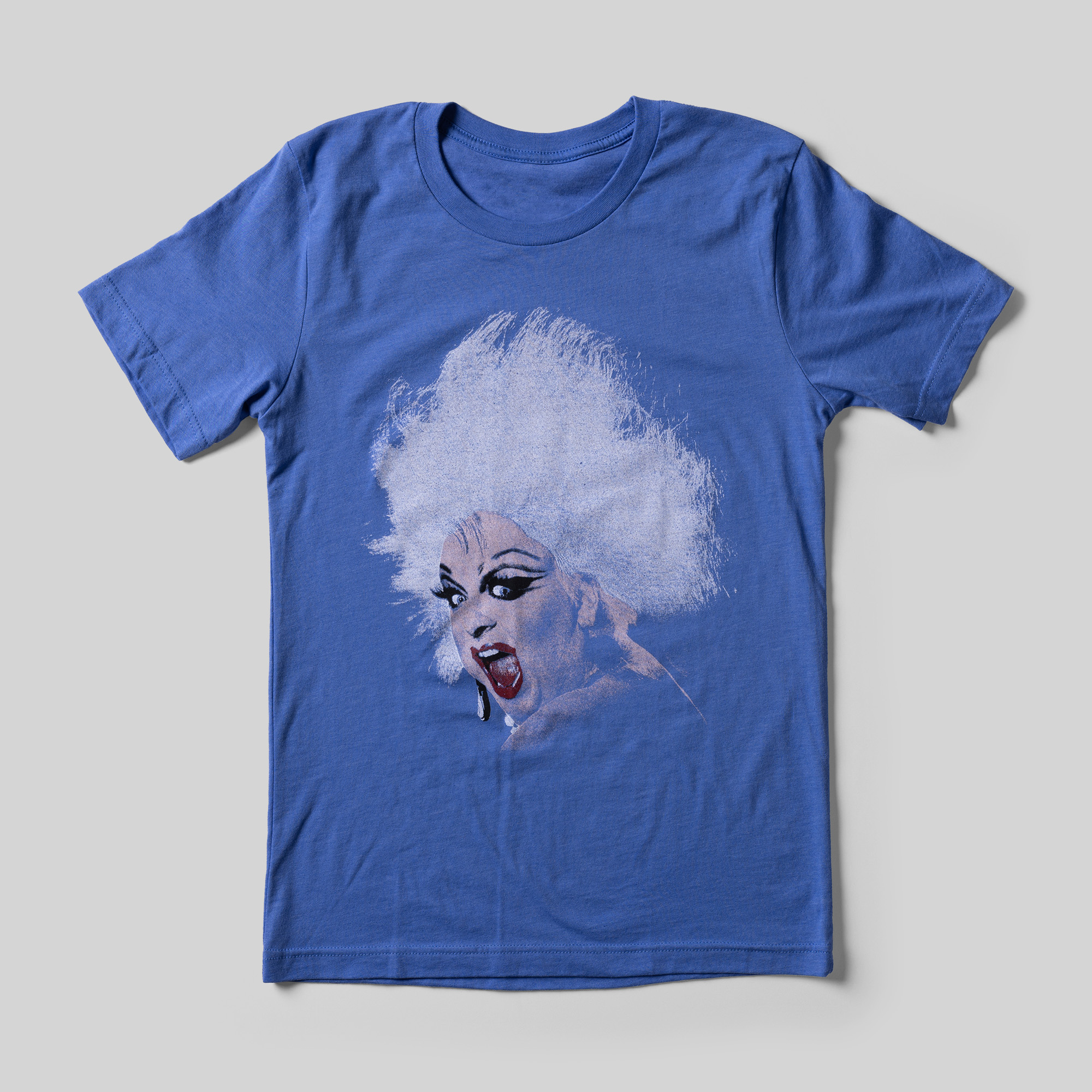 A blue t-shirt with an illustration of Divine.