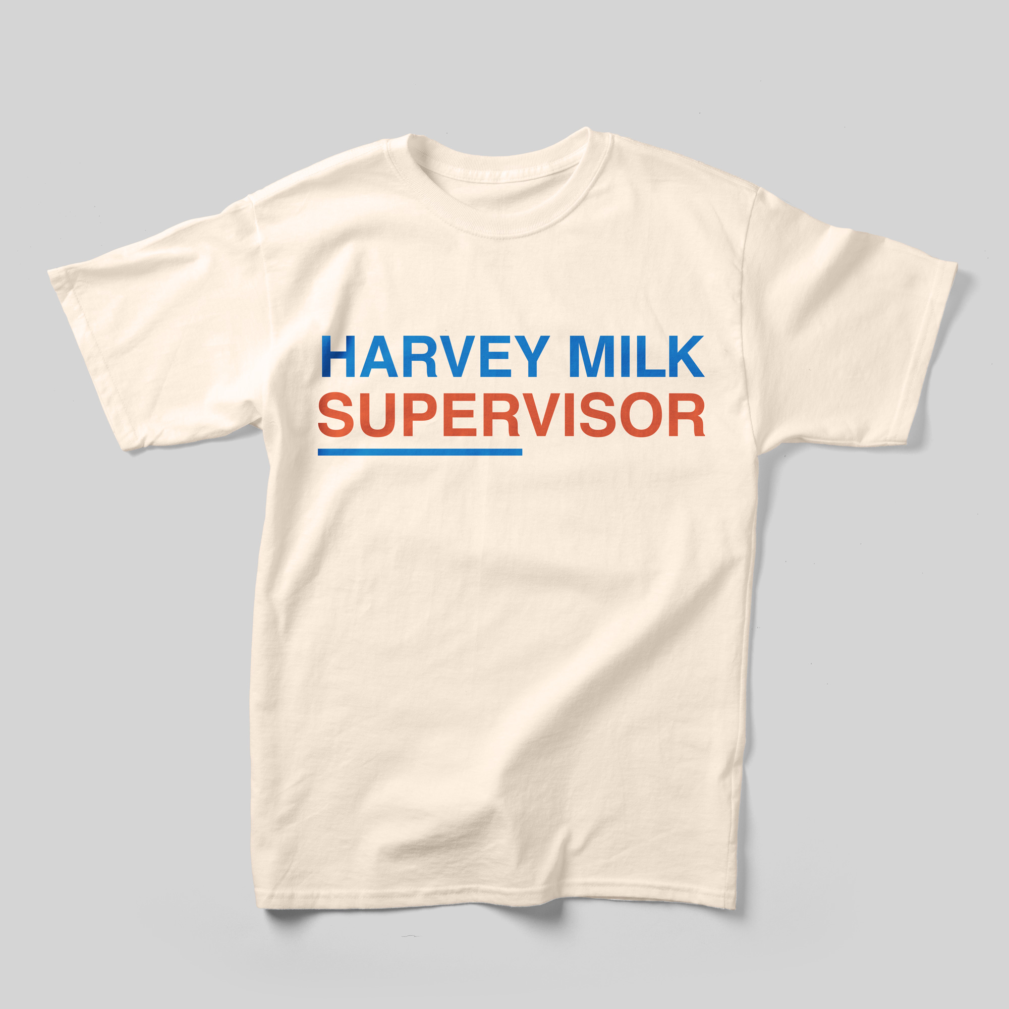 A beige t-shirt that reads "Harvey Milk Supervisor" in blue and red.