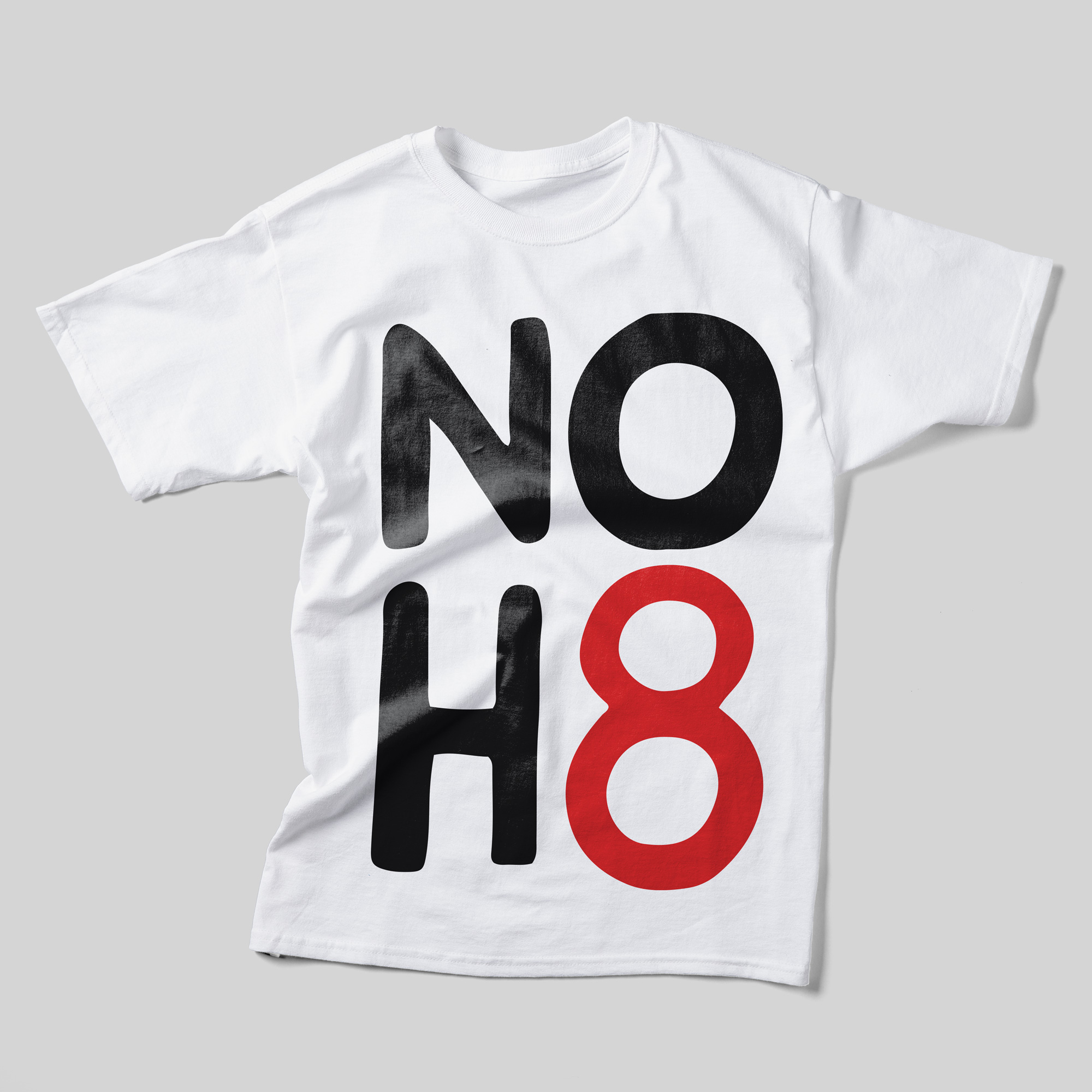 A white t-shirt with the NOH8 logo taking up the entire space of the front. "NOH" is in black and "8" is in red.