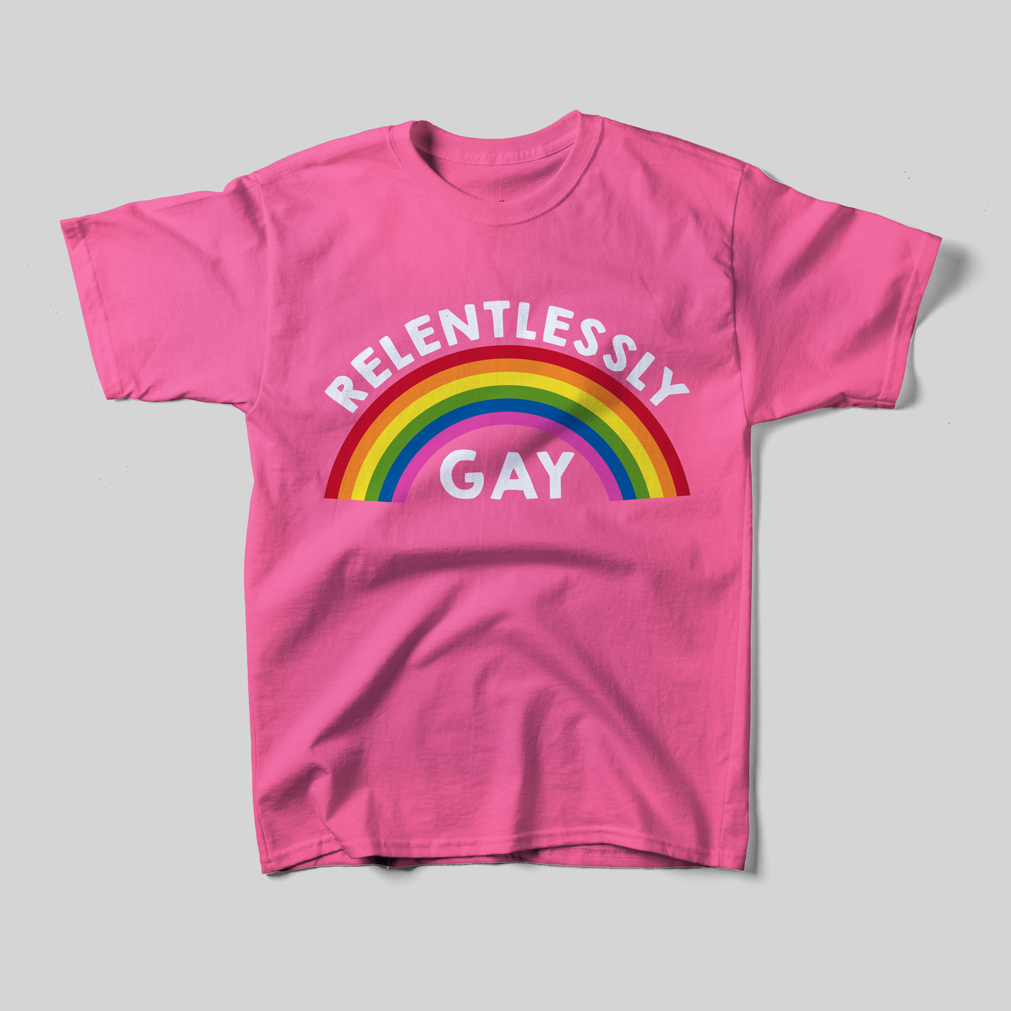 A pink t-shirt that reads Relentlessly Gay and an illustration of a rainbow between each word.
