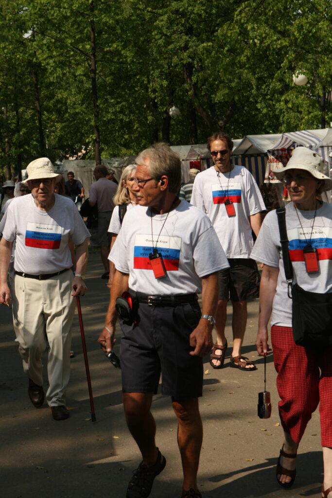 A group on a trip in Russia wearing matching custom t-shirts. 