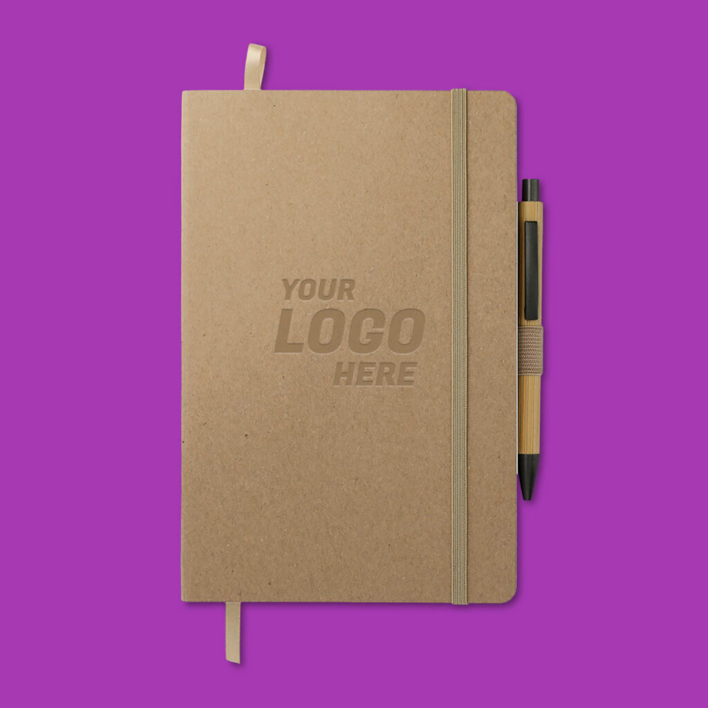A custom notebook with a pen that says "Your Logo Here." 