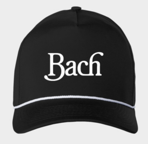 A black baseball cap featuring a white logo that reads "Bach"