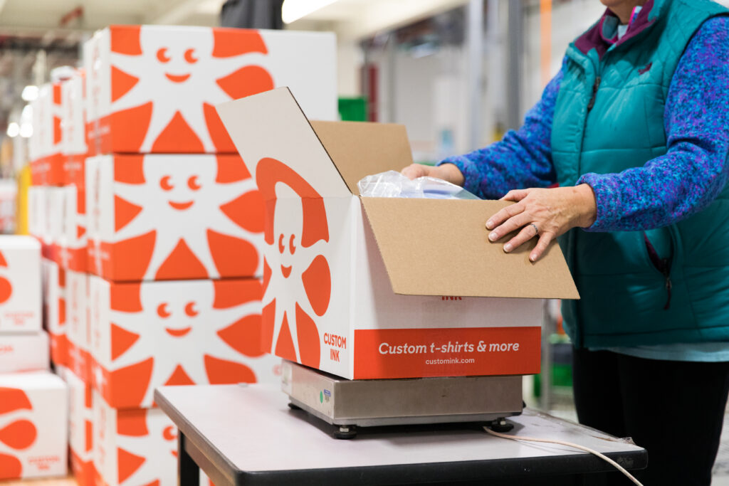 boxes full of custom t shirts, ordered in bulk