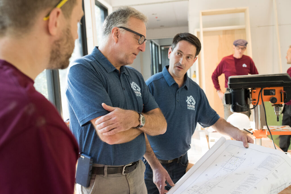 custom business t shirts being worn at a team meeting