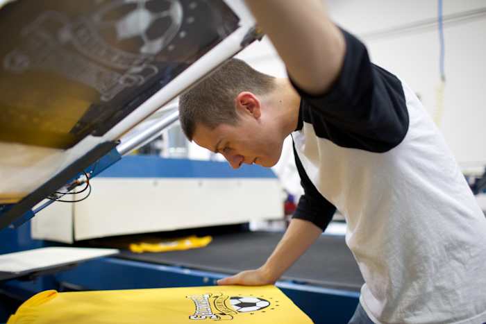 screen printing in action for custom apparel